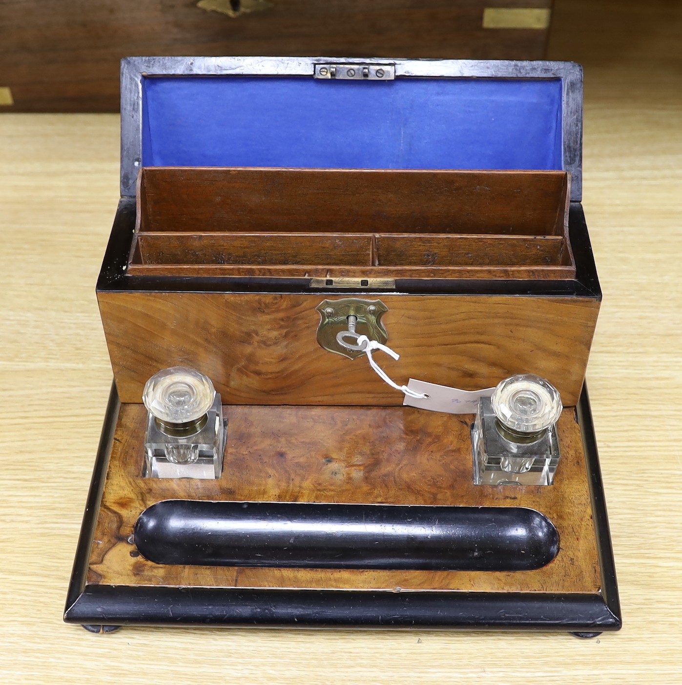 A Victorian brass bound rosewood writing slope and a Victorian walnut inkstand stationery rack, largest 50cm wide